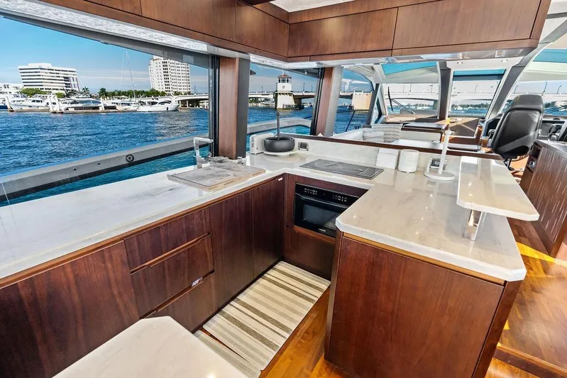  Yacht Photos Pics Luxurious kitchen interior of 2018 Galeon 640 Fly yacht with waterfront view.