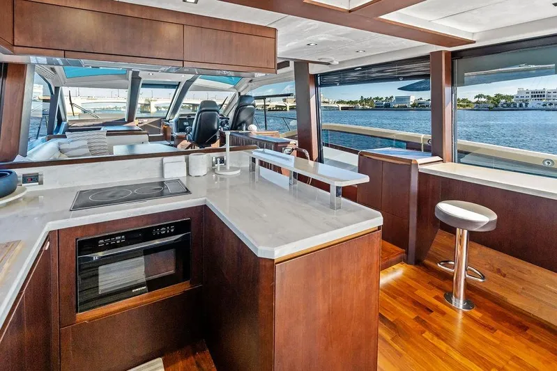  Yacht Photos Pics Luxurious interior of 2018 Galeon 640 Fly yacht with modern kitchen and scenic water views.