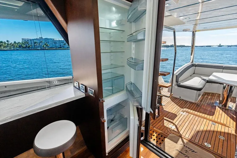  Yacht Photos Pics Luxurious 2018 Galeon 640 Fly yacht interior with open fridge and scenic ocean view.