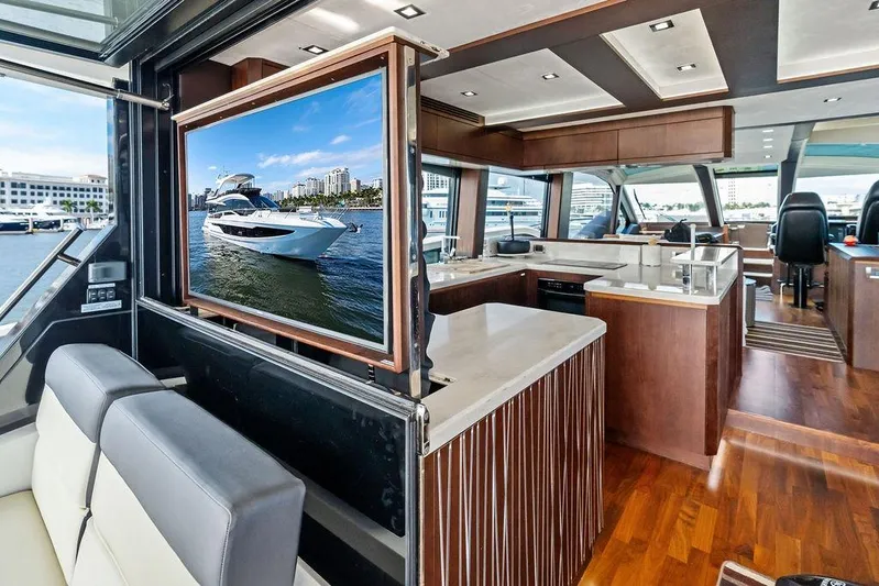  Yacht Photos Pics Luxurious interior of 2018 Galeon 640 Fly yacht with modern kitchen and seating area.