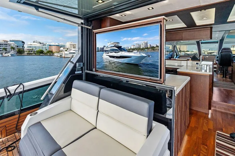  Yacht Photos Pics Luxurious interior of 2018 Galeon 640 Fly yacht with waterfront view.
