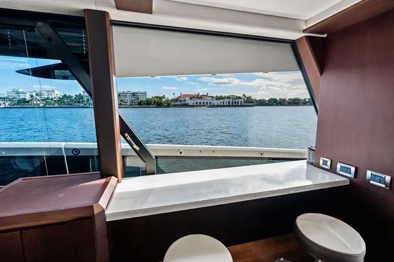  Yacht Photos Pics Interior view from 2018 Galeon 640 Fly yacht, overlooking serene waterfront scenery.