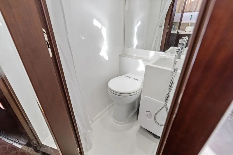  Yacht Photos Pics Bathroom interior of 2018 Galeon 640 Fly yacht, featuring modern fixtures and sleek design.