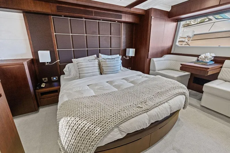  Yacht Photos Pics Luxurious bedroom interior of 2018 Galeon 640 Fly yacht with elegant wood finishes.