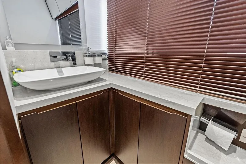  Yacht Photos Pics Luxurious bathroom in 2018 Galeon 640 Fly yacht with modern sink and wooden cabinets.
