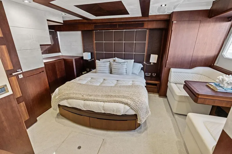  Yacht Photos Pics Luxurious bedroom interior of 2018 Galeon 640 Fly yacht with elegant wood finishes.