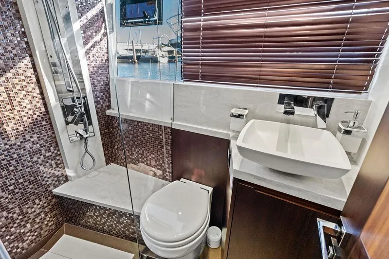  Yacht Photos Pics Luxurious bathroom on 2018 Galeon 640 Fly yacht with modern fixtures and mosaic tiles.