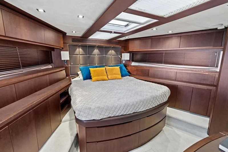 Yacht Photos Pics Luxurious bedroom interior of 2018 Galeon 640 Fly yacht with modern wood finish.