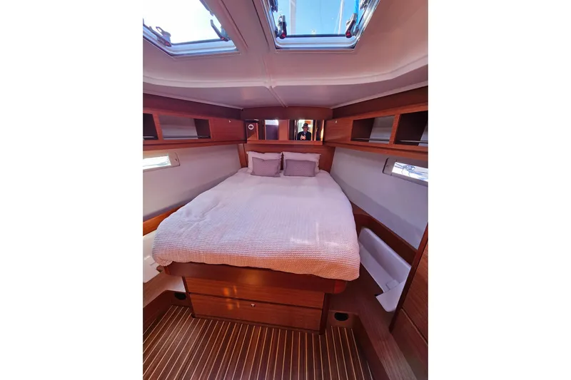 Send Me Yacht Photos Pics Luxurious cabin interior of 2018 Dufour 460 Grand Large yacht with cozy bedding.
