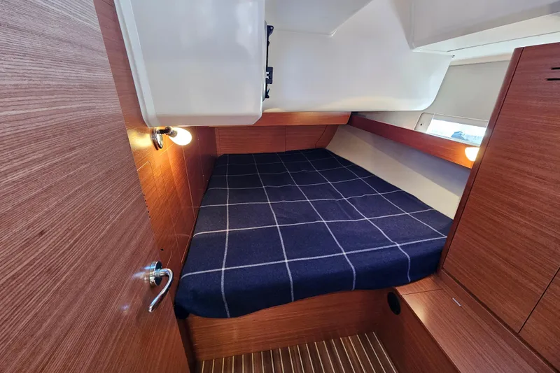 Send Me Yacht Photos Pics Cozy cabin interior of 2018 Dufour 460 Grand Large yacht with wooden finish.