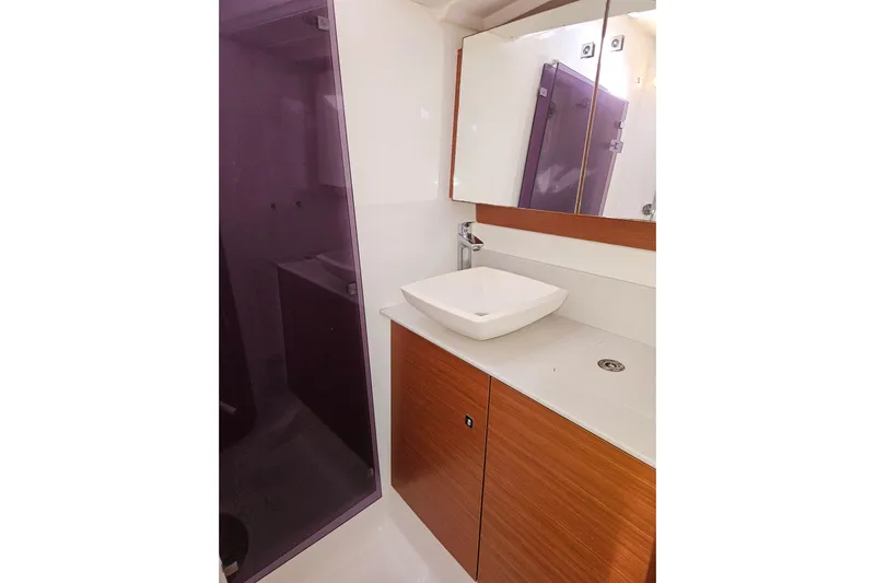 Send Me Yacht Photos Pics Modern bathroom in 2018 Dufour 460 Grand Large yacht with sleek sink and mirror.