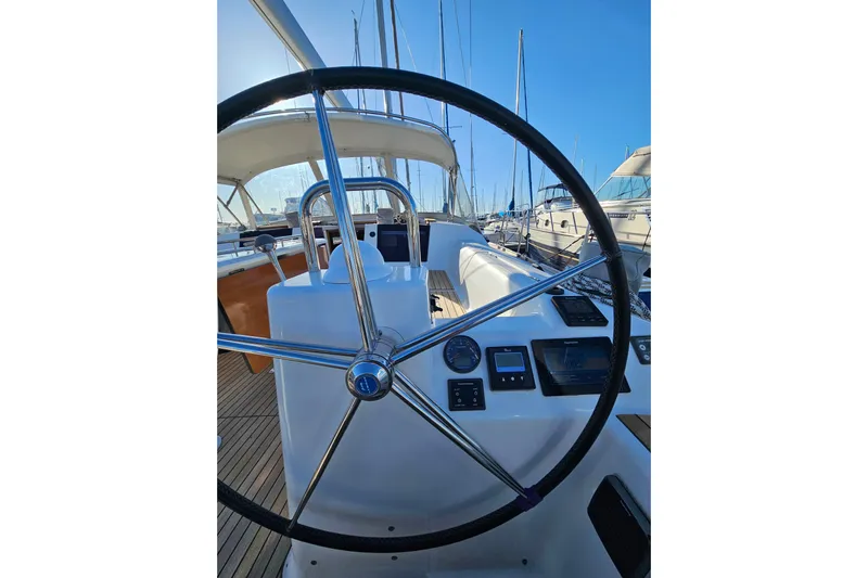 Send Me Yacht Photos Pics 2018 Dufour 460 Grand Large yacht cockpit with steering wheel and navigation instruments.