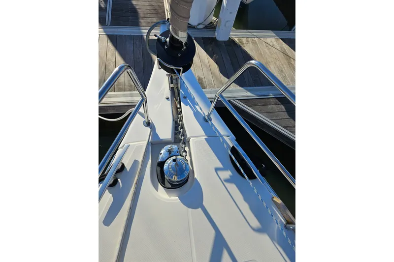 Send Me Yacht Photos Pics Bow of 2018 Dufour 460 Grand Large yacht with anchor chain and winch.