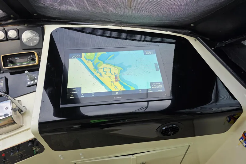 Hatt Trick Yacht Photos Pics Garmin navigation display on 1990 Hatteras 52 Cockpit Motor Yacht dashboard.
