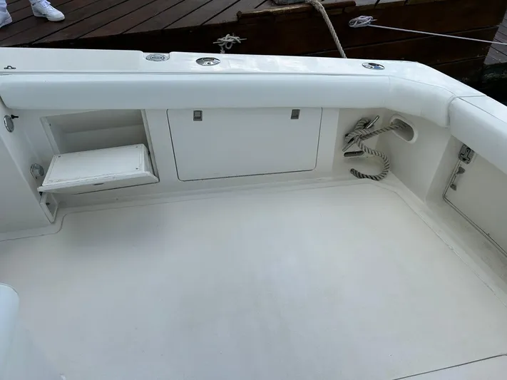 El Caiman Yacht Photos Pics 1994 Bertram 46 Moppie boat deck with storage compartments and coiled rope.