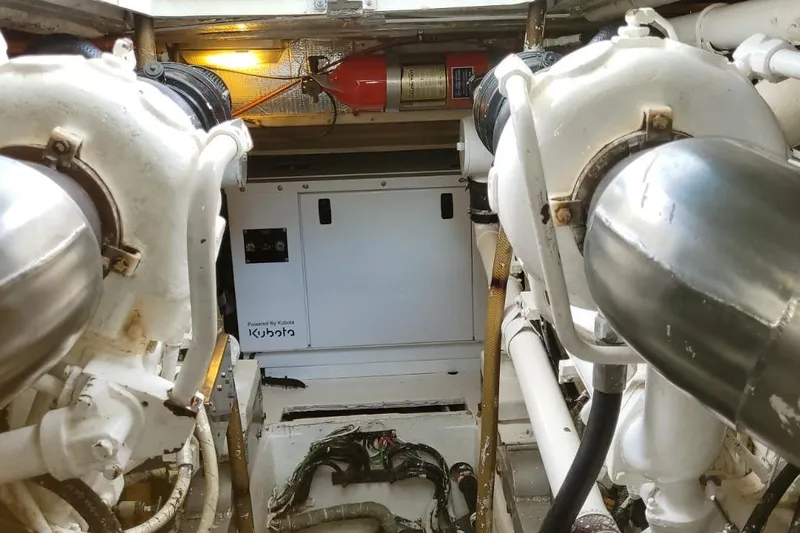 El Caiman Yacht Photos Pics Engine room of 1994 Bertram 46 Moppie with Kubota generator and fire extinguisher.