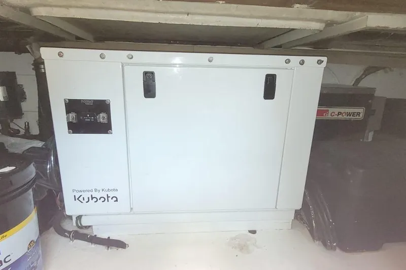 El Caiman Yacht Photos Pics Kubota generator in 1994 Bertram 46 Moppie engine room, featuring C-Power equipment.