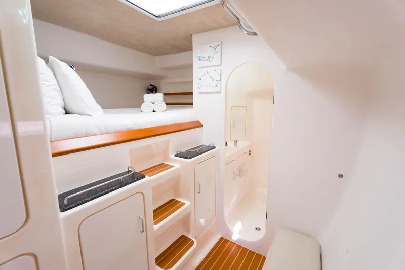 Osprey Yacht Photos Pics Luxurious interior of 2010 Voyage 520 yacht with cozy bed and modern bathroom.