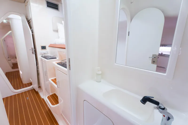 Osprey Yacht Photos Pics Interior of 2010 Voyage 520 yacht featuring modern bathroom and kitchenette.