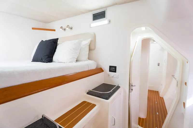 Osprey Yacht Photos Pics Interior cabin of 2010 Voyage 520 yacht with bed and modern amenities.
