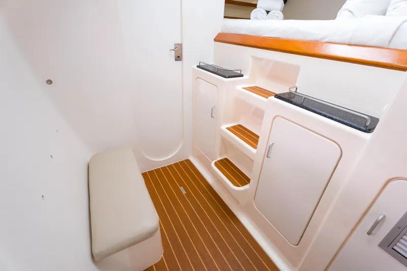 Osprey Yacht Photos Pics Interior of 2010 Voyage 520 yacht with wooden flooring and built-in storage.