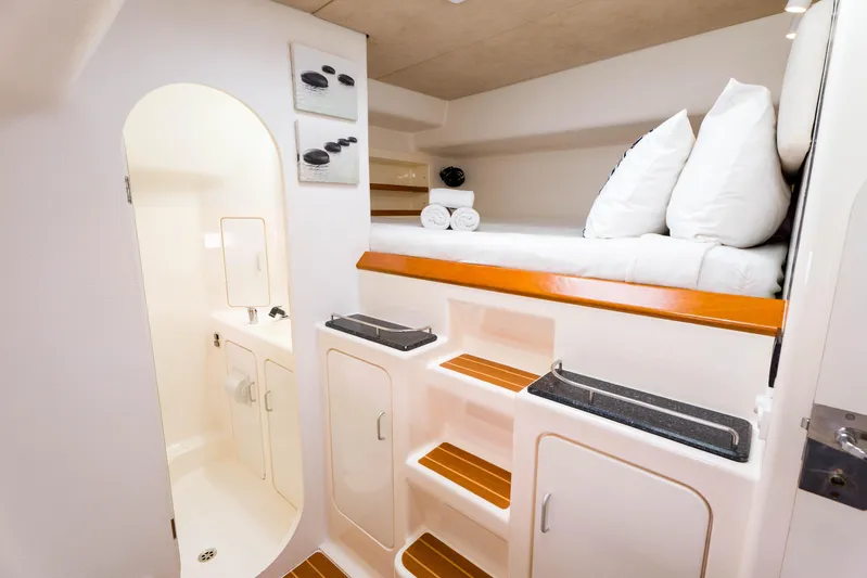 Osprey Yacht Photos Pics Luxurious interior of 2010 Voyage 520 yacht with cozy bed and compact bathroom.