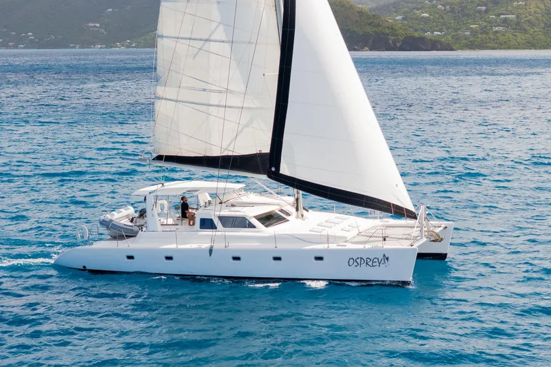 Osprey Yacht Photos Pics Sailing catamaran Voyage 520, 2010 model, cruising on blue ocean waters.
