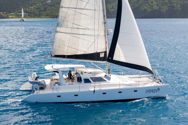 Osprey Yacht Photos Pics Sailing catamaran Voyage 520, 2010 model, cruising on blue ocean waters.