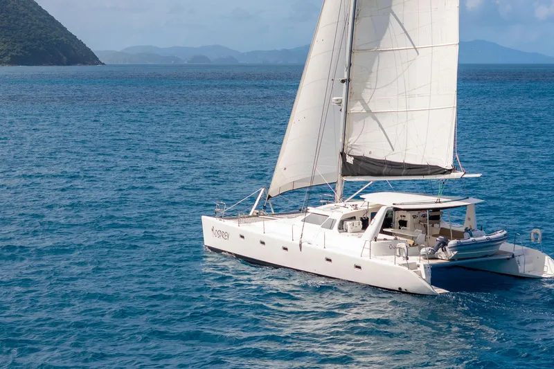 Osprey Yacht Photos Pics Sailing catamaran Voyage 520, 2010 model, cruising on blue ocean waters.