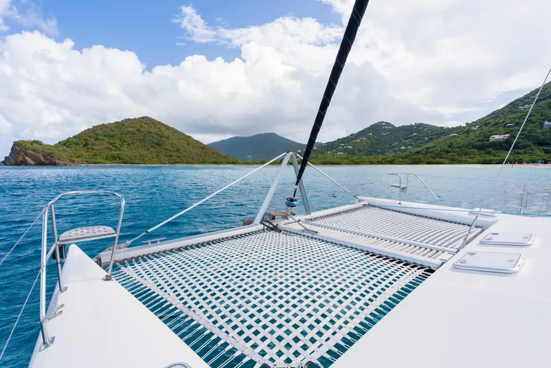 Osprey Yacht Photos Pics Catamaran Voyage 520 sailing near lush island, clear blue waters, 2010 model.