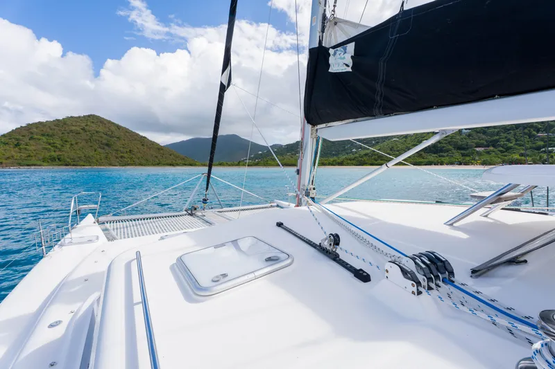 Osprey Yacht Photos Pics Sailing on a 2010 Voyage 520 catamaran in tropical waters with lush island views.