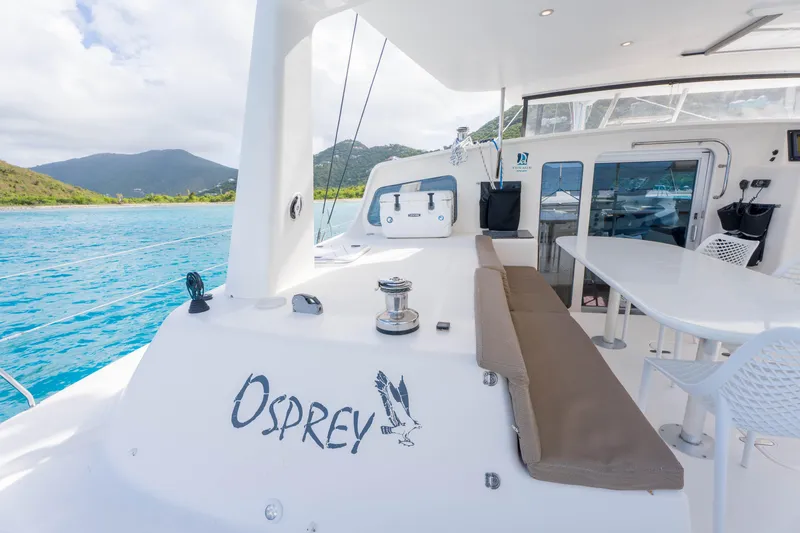 Osprey Yacht Photos Pics Catamaran Voyage 520, 2010 model, with "Osprey" branding, docked in scenic waters.