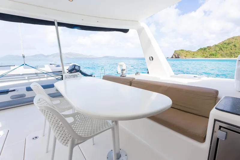 Osprey Yacht Photos Pics Luxurious Voyage 520 yacht interior with ocean view, featuring a sleek dining area, 2010 model.