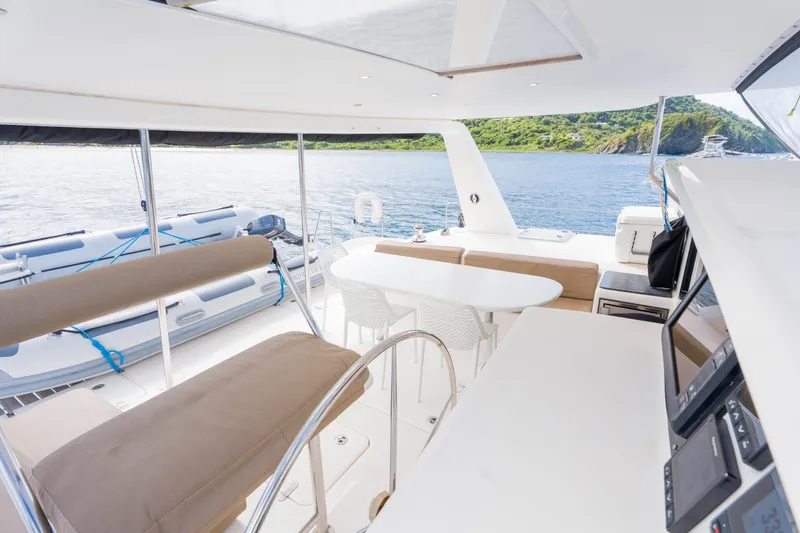 Osprey Yacht Photos Pics Spacious deck of 2010 Voyage 520 yacht with seating and ocean view.