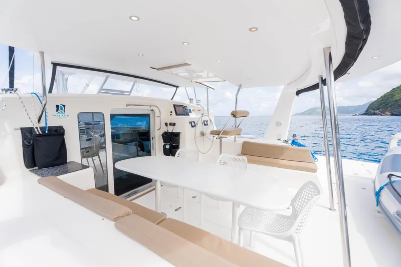 Osprey Yacht Photos Pics Spacious deck of 2010 Voyage 520 yacht with seating, table, and ocean view.