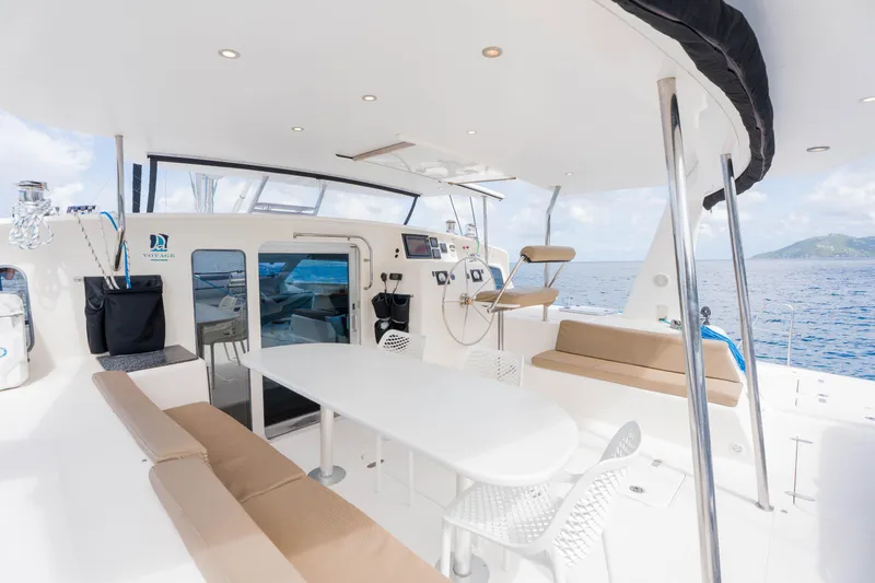 Osprey Yacht Photos Pics Spacious deck of 2010 Voyage 520 catamaran with seating and ocean view.