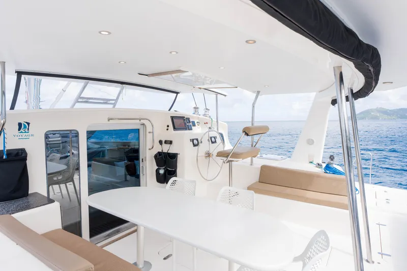 Osprey Yacht Photos Pics Spacious deck of 2010 Voyage 520 yacht with seating and ocean view.