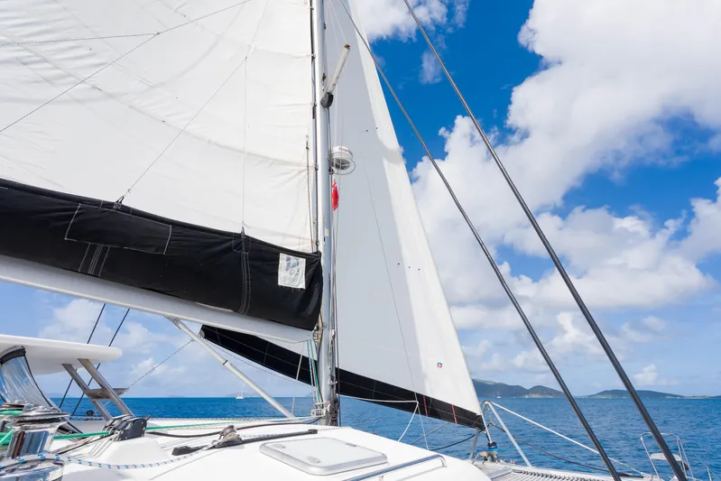 Osprey Yacht Photos Pics Sailing on a 2010 Voyage 520 catamaran under clear blue skies.