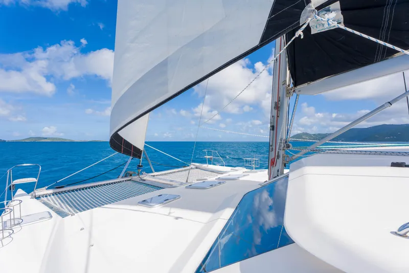 Osprey Yacht Photos Pics Sailing on a 2010 Voyage 520 catamaran in clear blue ocean waters.