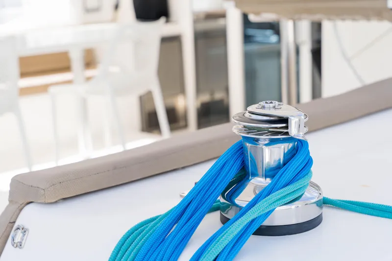 Osprey Yacht Photos Pics Winch with blue rope on 2010 Voyage 520 yacht deck.