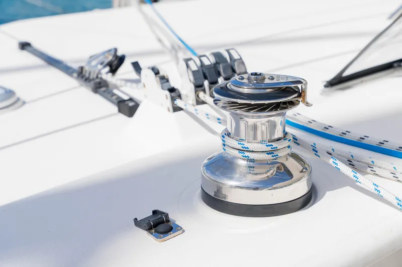 Osprey Yacht Photos Pics Close-up of a 2010 Voyage 520 yacht winch with ropes on deck.