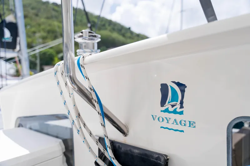 Osprey Yacht Photos Pics Close-up of 2010 Voyage 520 yacht with logo and ropes on deck.