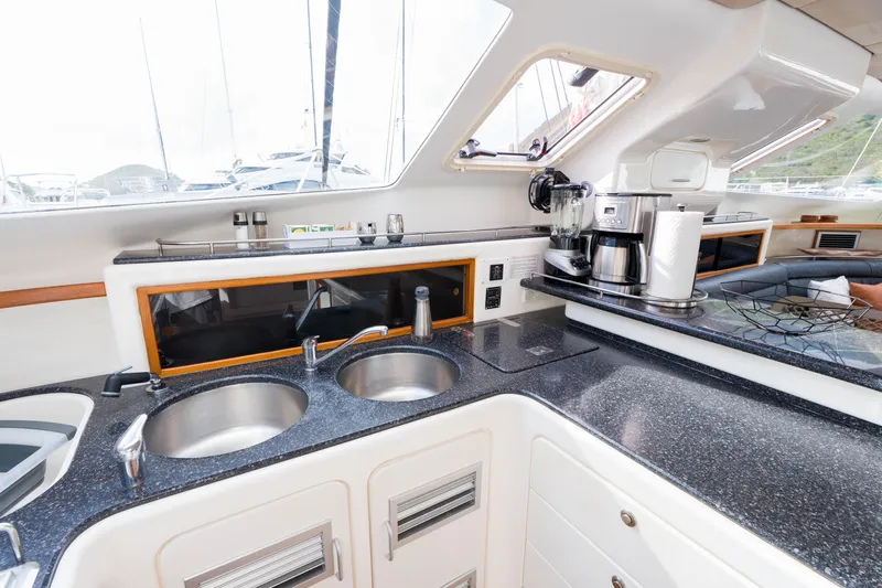 Osprey Yacht Photos Pics Modern kitchen interior on 2010 Voyage 520 yacht with dual sinks and appliances.