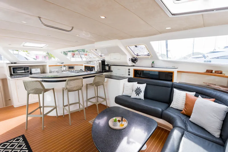 Osprey Yacht Photos Pics Luxurious interior of 2010 Voyage 520 yacht with modern kitchen and cozy seating area.