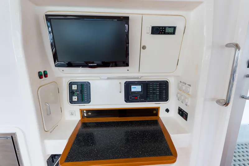 Osprey Yacht Photos Pics Control panel of a 2010 Voyage 520 yacht with electronic displays and switches.