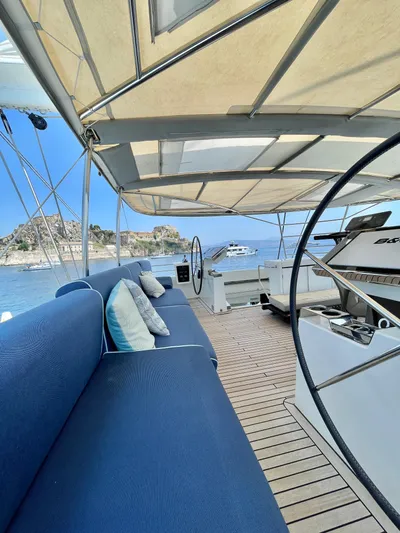  Yacht Photos Pics Luxurious 2018 Lagoon 620 yacht deck with blue seating and scenic ocean view.
