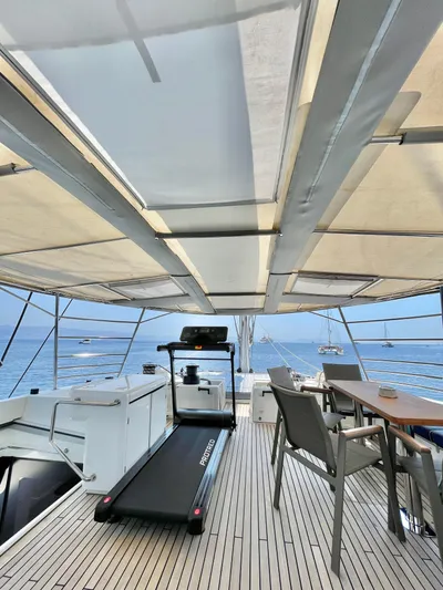  Yacht Photos Pics Luxurious Lagoon 620 yacht deck with treadmill and dining area, 2018 model.
