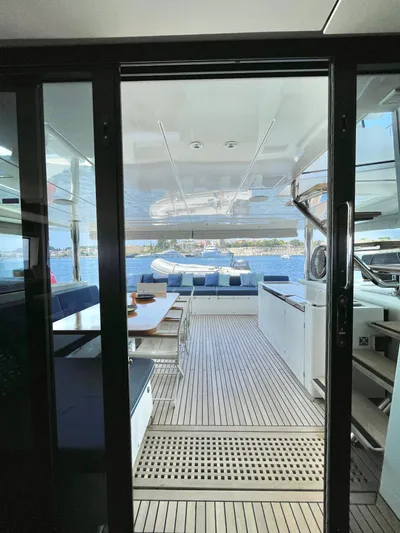  Yacht Photos Pics Lagoon 620 yacht interior, 2018 model, featuring spacious deck and seating area with ocean view.