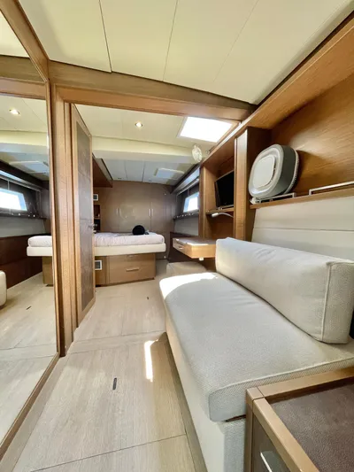  Yacht Photos Pics Interior of 2018 Lagoon 620 yacht with modern furnishings and cozy seating area.