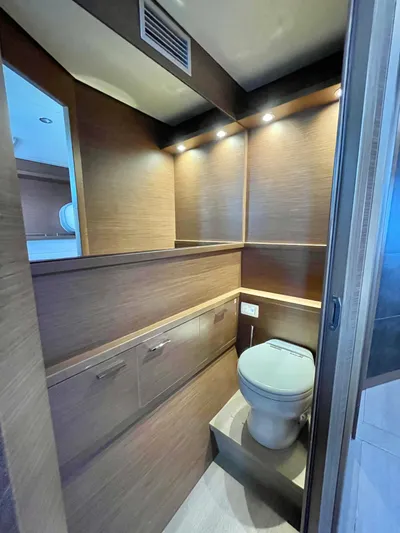  Yacht Photos Pics Luxurious bathroom in 2018 Lagoon 620 yacht with modern wood finish and ambient lighting.